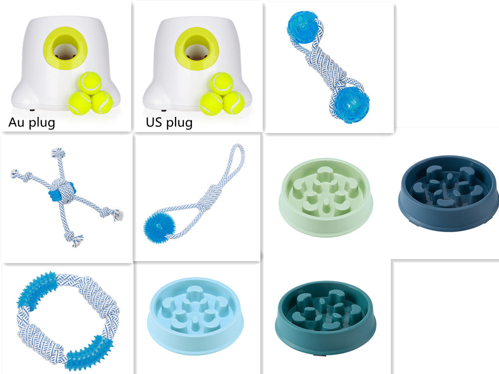 Orange Poppy automatic dog ball launcher with yellow tennis balls and assorted blue rope toys and slow feeder bowls