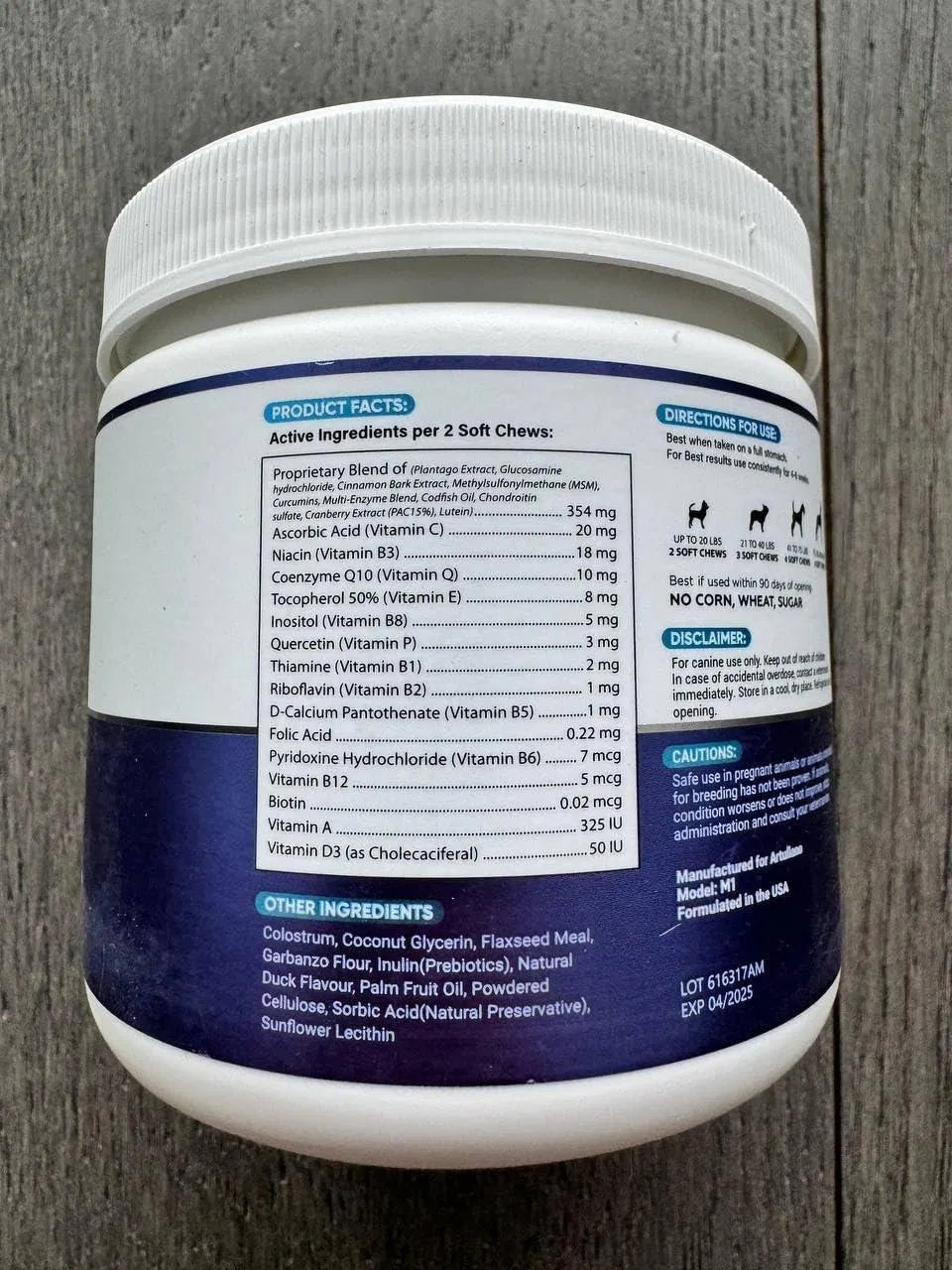 Orange Poppy white jar showing supplement facts label for 20 in 1 dog vitamins for skin and coat health soft chews