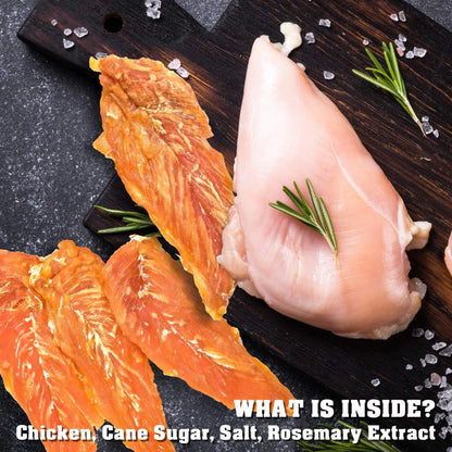 Orange Poppy chicken treats on wooden board with rosemary and salt suggesting organic high protein dog chews for pets