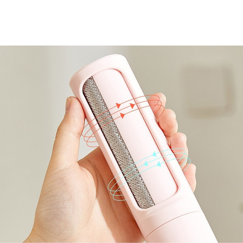 Orange Poppy pink handheld reusable pet hair remover brush with textured strip for beds and blankets