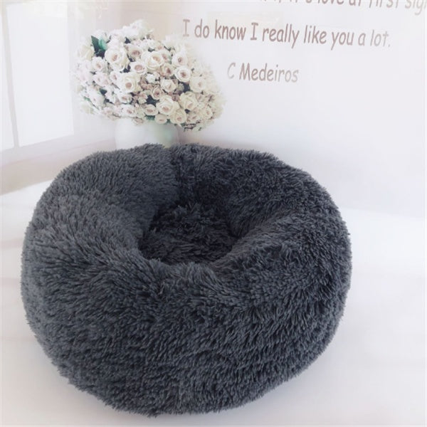 Orange Poppy round fluffy cat bed in dark gray donut shape with high plush rim for cozy naps