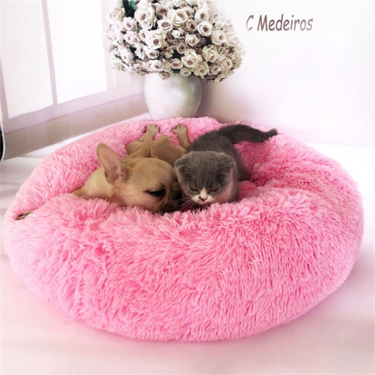 Orange Poppy pink round fluffy cat bed with sleeping kitten and small dog cuddled inside soft donut cushion