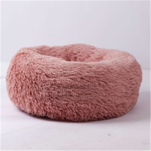 Orange Poppy round fluffy cat bed in dusty rose faux fur donut shape with raised bolster for cozy pet naps