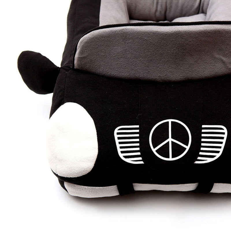 Orange Poppy black and gray dog bed shaped like a car with plush headlights and cushioned interior