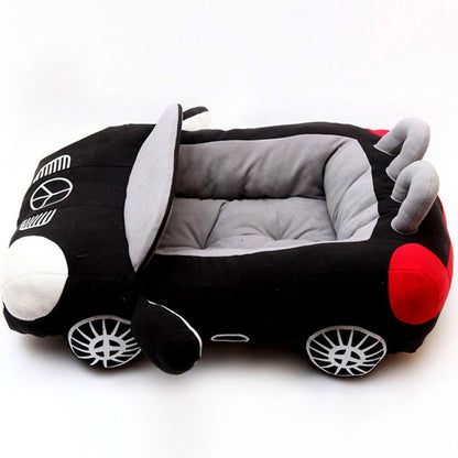 Orange Poppy plush dog bed shaped like a car in black and gray with padded cushion and wheel details