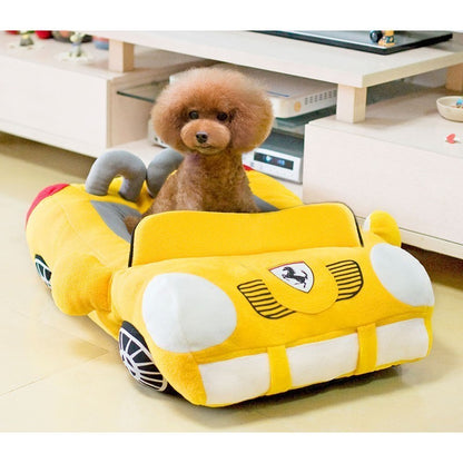 Orange Poppy yellow plush dog bed shaped like a car with cushioned interior and small poodle