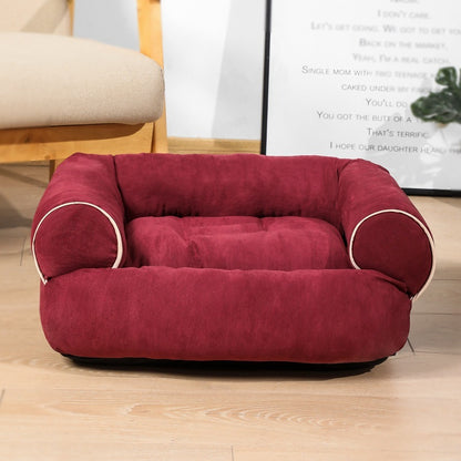 Orange Poppy maroon plush pet bed warm cat and dog cushion with bolstered sides on wooden floor
