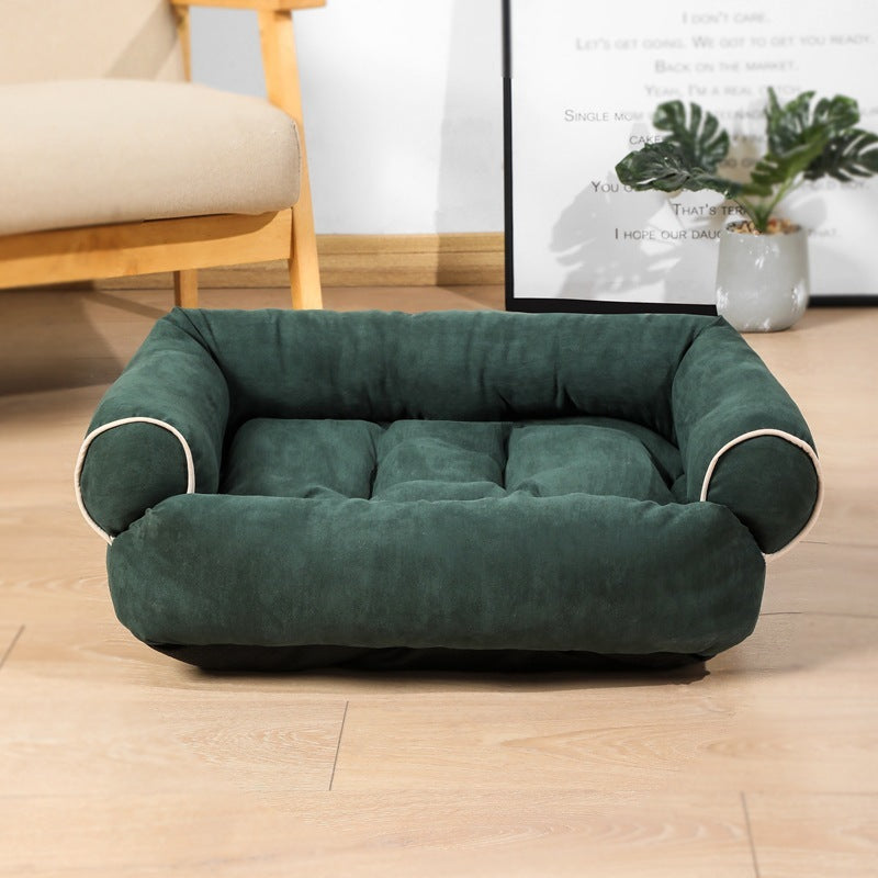 Orange Poppy green plush pet bed with bolstered sides and tufted cushion on wooden floor warm cat and dog cushion