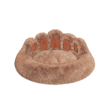 Cute plush cat bed for indoor cats designed like a paw print for cozy lounging