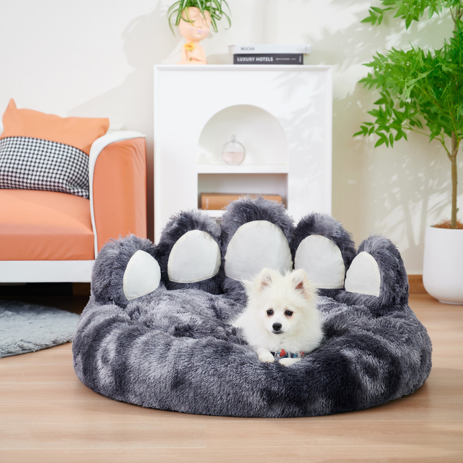 Cute plush cat bed for indoor cats designed like a paw with a cozy, soft surface for pets