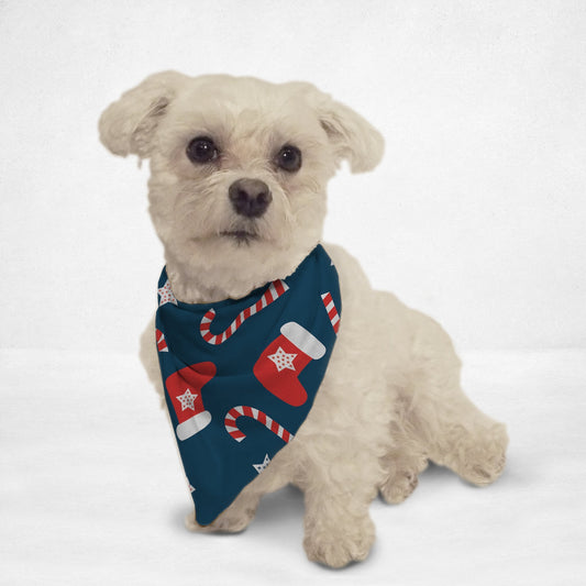 Small white dog wearing Orange Poppy holiday pet bandana with candy cane and stocking design