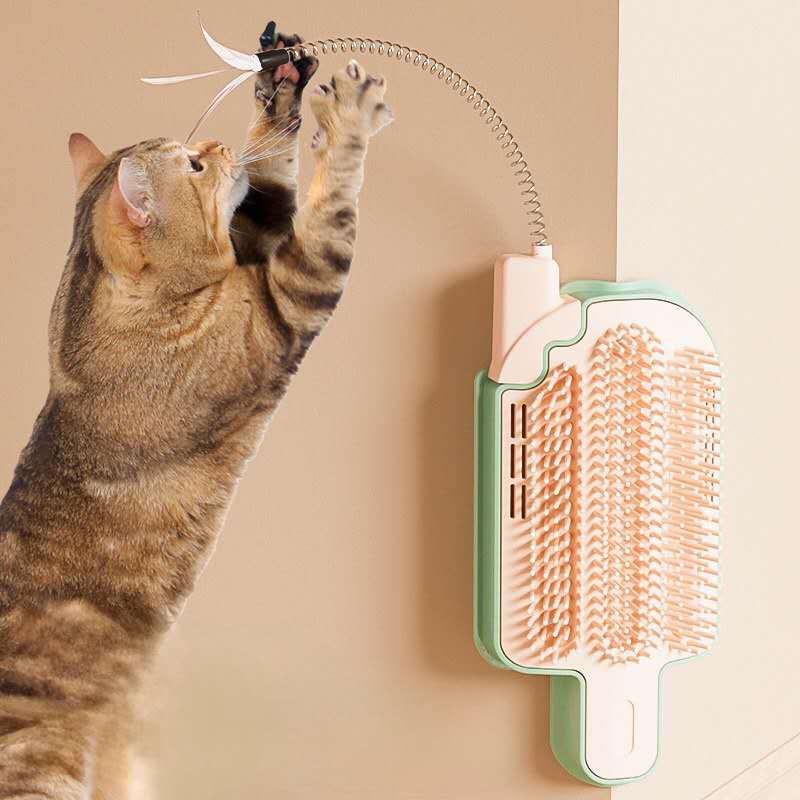 Interactive cat grooming toy attached to a wall with a cat playfully reaching for it