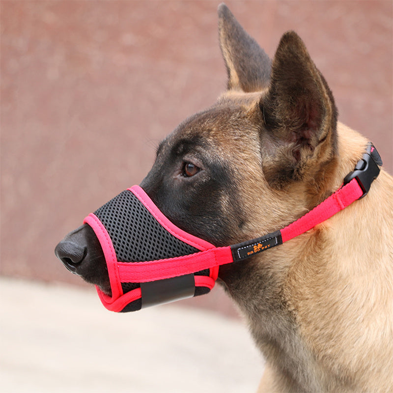 Orange Poppy adjustable dog muzzle for biting on a tan working dog in pink and black mesh with padded straps