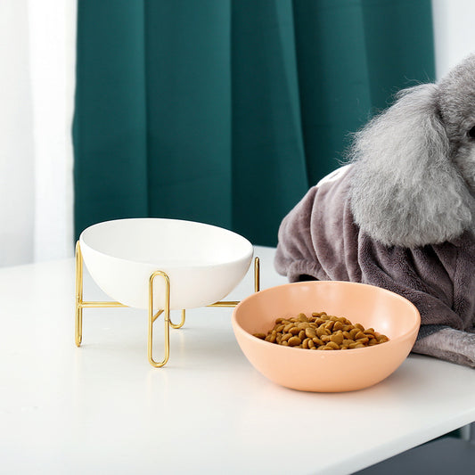 Orange Poppy ceramic pet bowls on gold stand with kibble and gray pet blanket durable pet feeding supplies