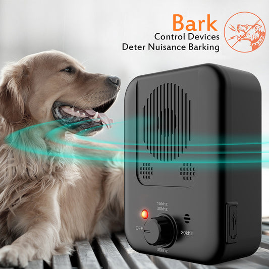 Orange Poppy ultrasonic anti bark device for dogs next to golden retriever on bed to deter nuisance barking