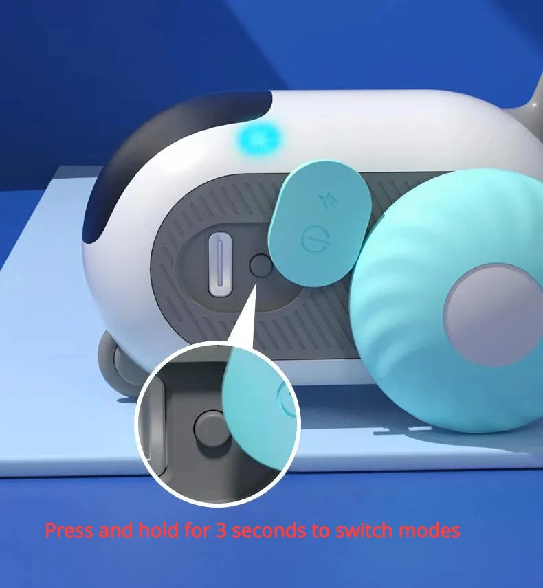 Orange Poppy remote control cat toy with teal detachable wheel and power button on blue display