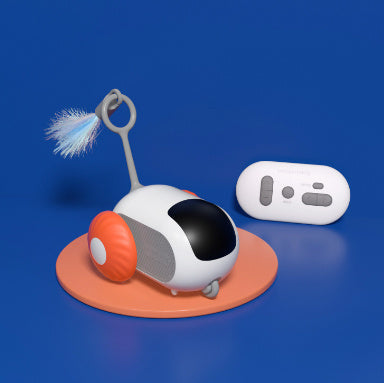 Orange Poppy remote control cat toy robotic pod with feather wand and handheld controller on round mat
