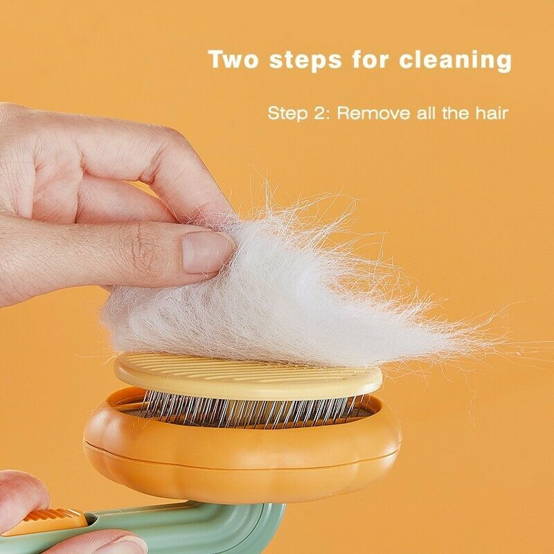 Orange self cleaning slicker brush for pets being cleaned by hand removing white pet fur