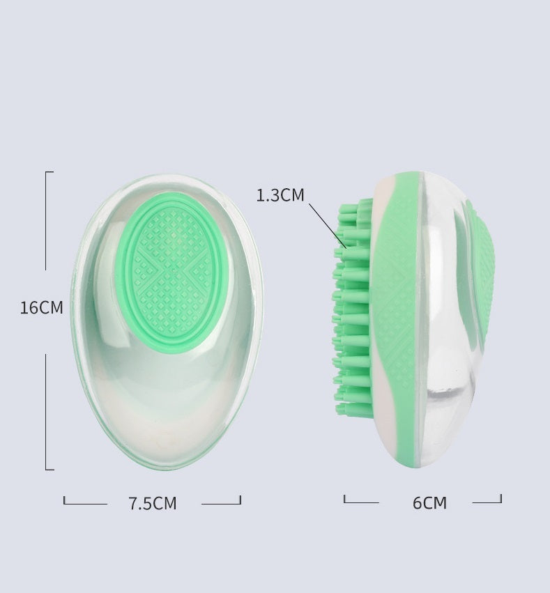 Pet Haven Delights cat and dog massage comb in green, designed for comfortable grooming and relaxation.