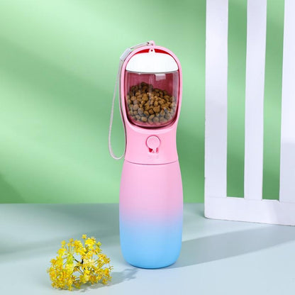 Pet travel water bottle in pink and blue with a food compartment for convenient pet hydration