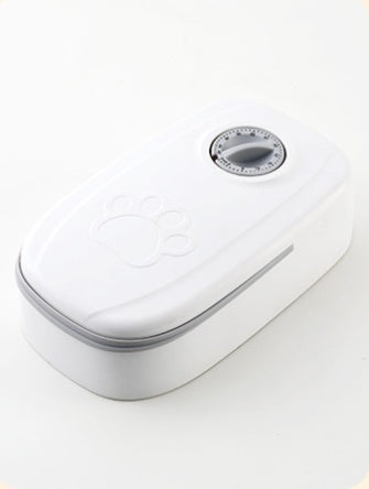 Orange Poppy white smart pet food dispenser for cats and dogs with paw imprint and timer dial