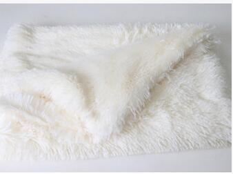 Orange Poppy white faux fur pet blanket folded on table soft pet blankets for dogs and cats cozy