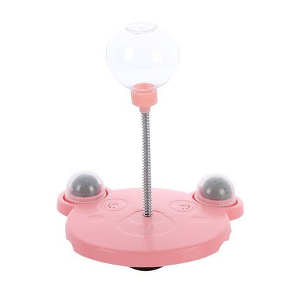 Orange Poppy pink interactive cat feeder toy with clear treat dispenser globe on spring and two rolling ball stations