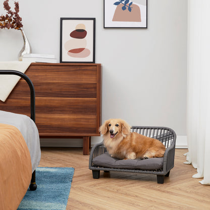 Ochre Menoetius woven rope pet bed with gray cushion featuring a small dog resting indoors